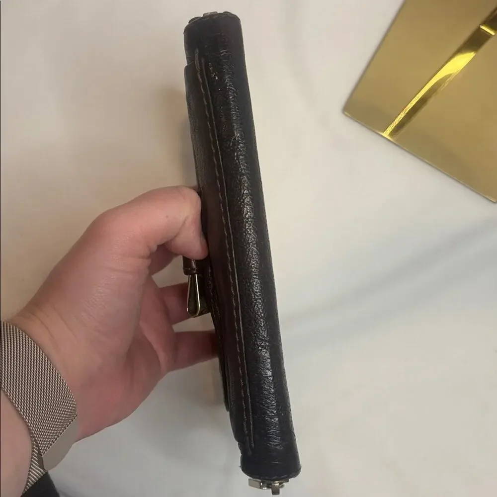 Chloe Lilly bow front long wallet in a metallic maroon brown